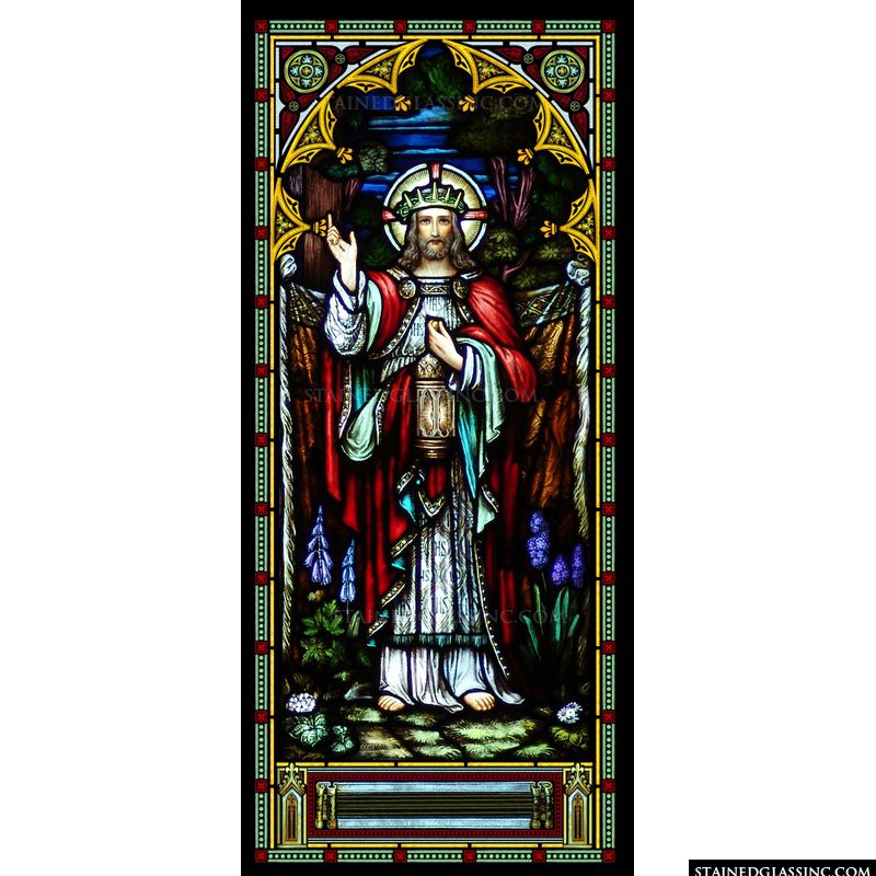 Jesus is pictured crowned and holding a lamp in this stained glass image. 