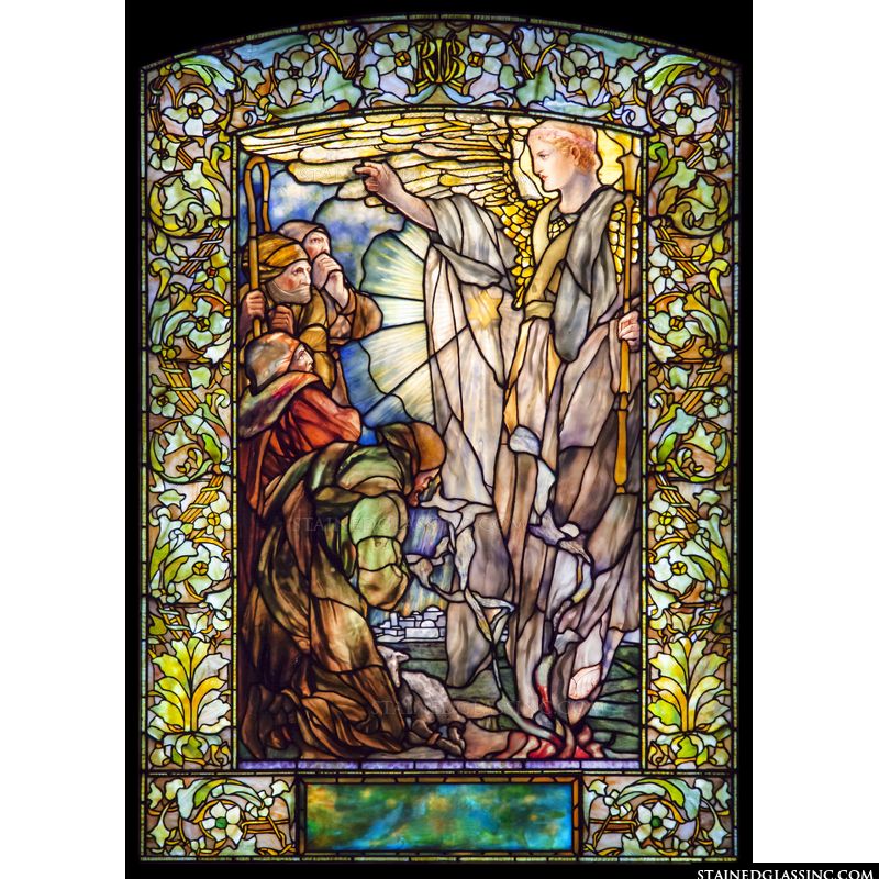 Shepherds and an angel in stained glass. 