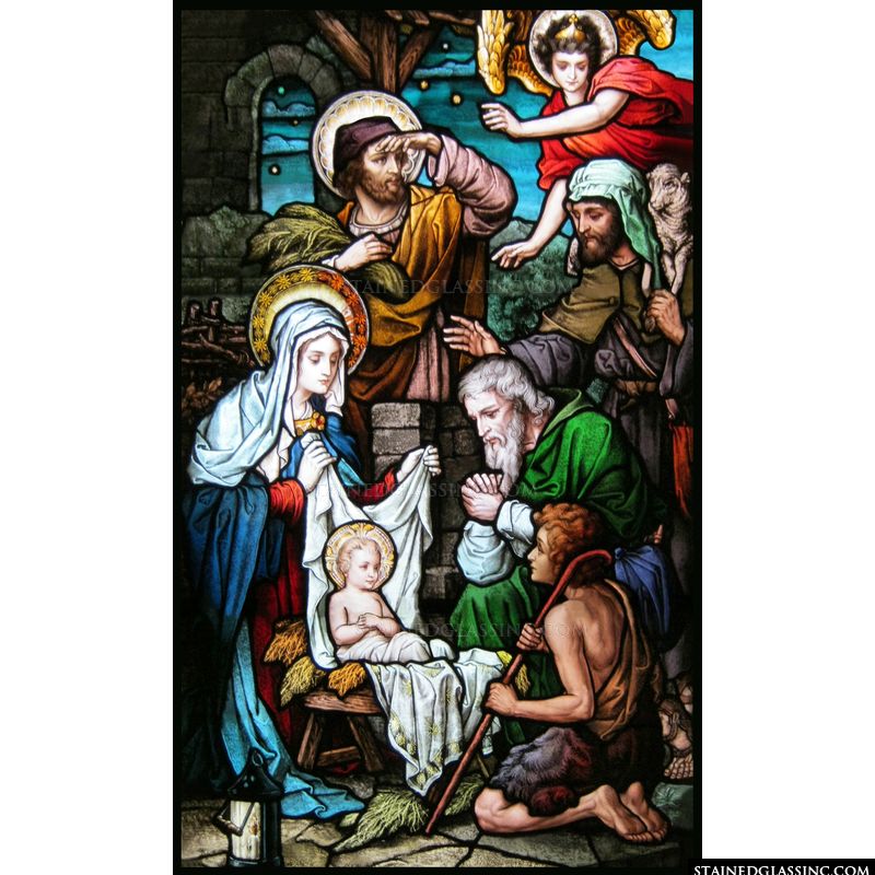 The birth of Jesus is depicted in brilliant color in this stained glass image. 