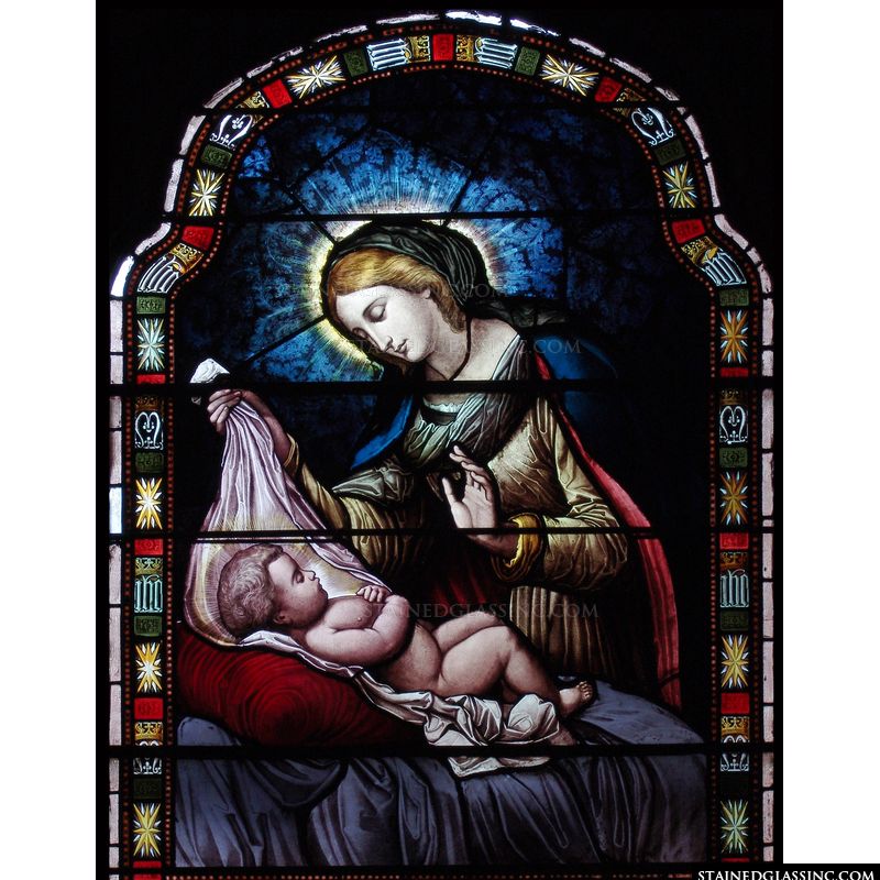 This stained glass image depicts Mary looking upon her new born son. 