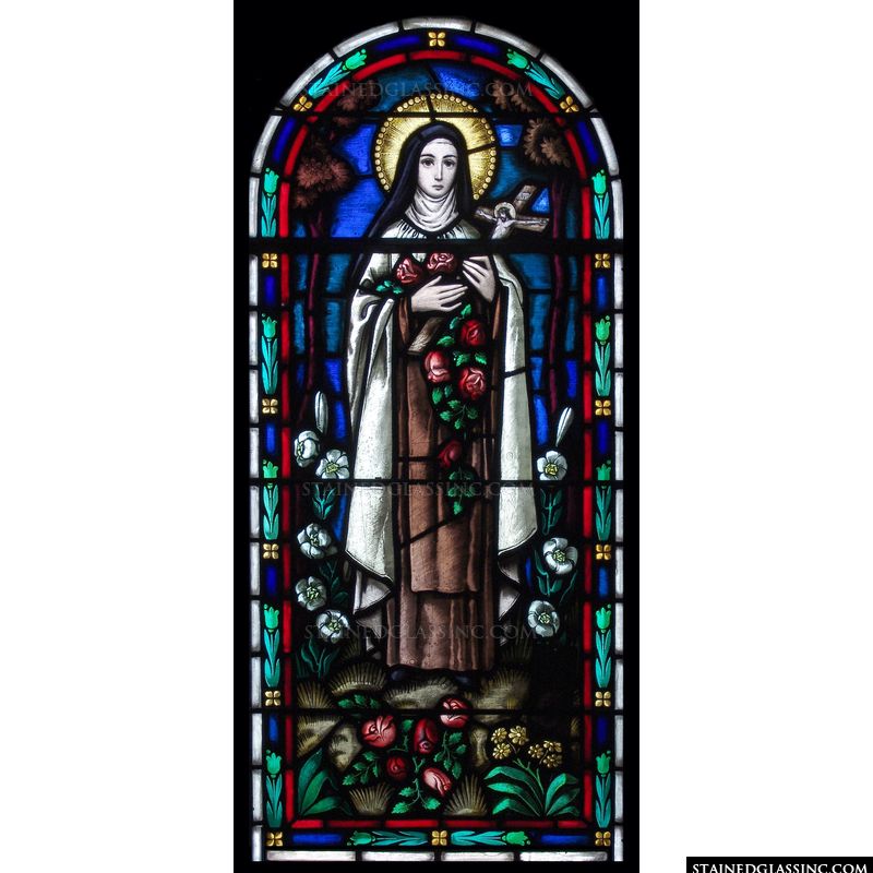 Saint Therese stained glass with roses and cross. 