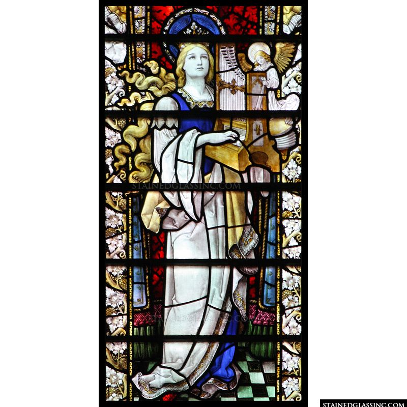 Stained glass depiction of St. Cecilia. 