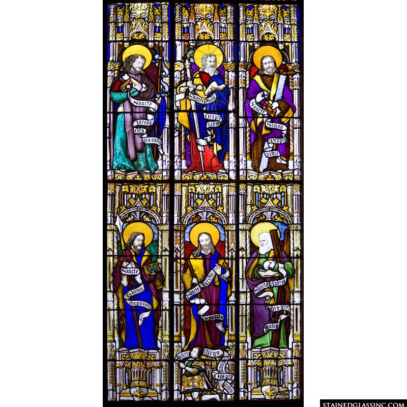 Several of Christ's disciples are pictured in this stained glass window. panel. 