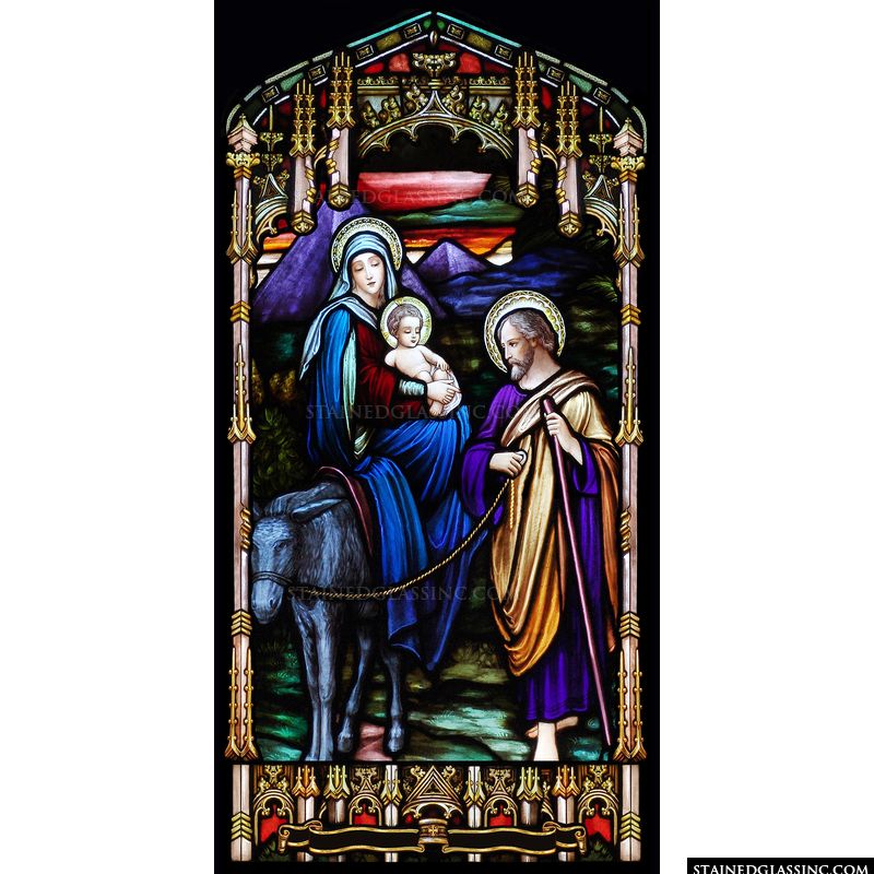 The Flight to Egypt is depicted in this cathedral style stained glass window. 