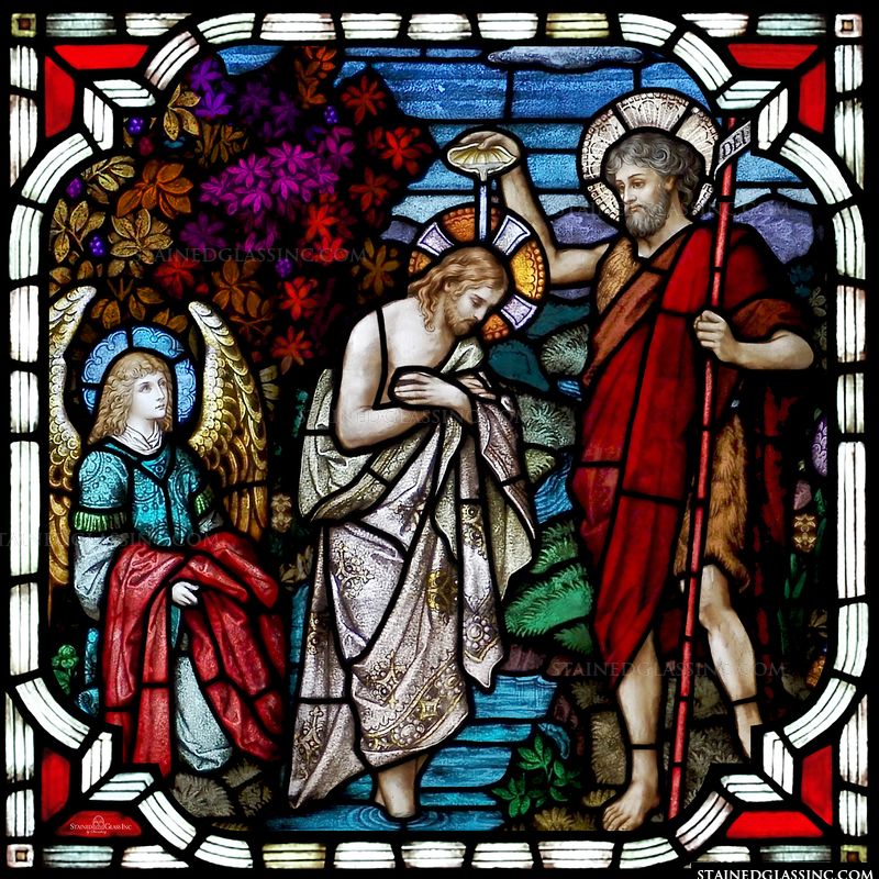 A beautiful stained glass depiction of Jesus' baptism. 