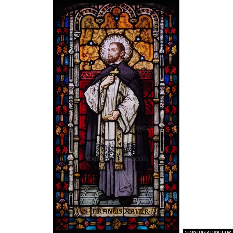 A beautiful stained glass window panel features Saint Francis Xavier. 