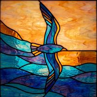 Seabird in Flight over Ocean Sunset