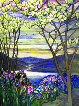 Magnolias and irises bloom in this stained glass depiction of a lake