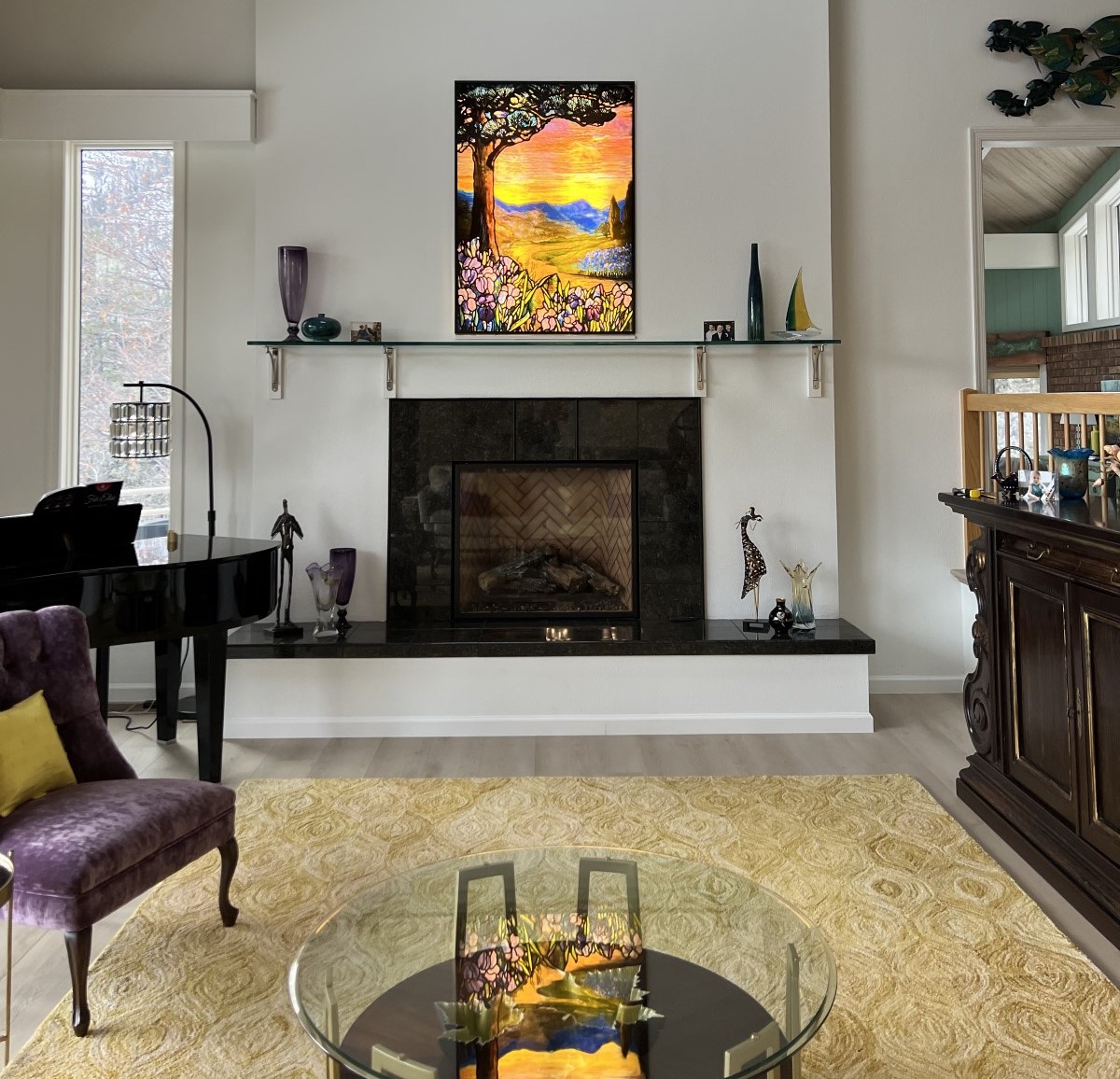 stained glass panel in customer living room over fireplace.