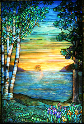 A ship is pictured sailing into the sunset in this Tiffany style stained glass piece
