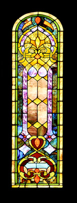 A colorful stained glass panel with a classic design