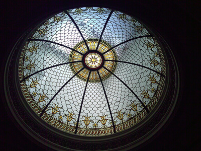 A large decorative dome in pictured with light shining through